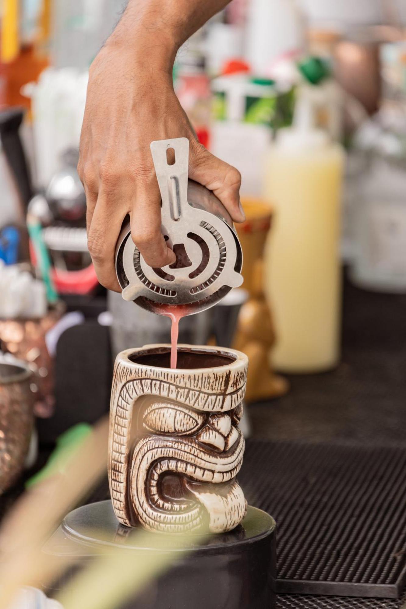 Skyview Resort Phuket Patong Beach Zewnętrze zdjęcie A bartender straining a tiki drink